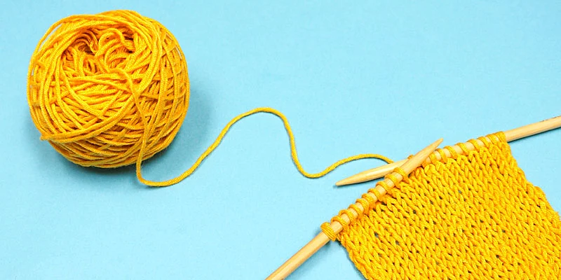 A skein of bamboo yarn neatly wound into a ball, ready for knitting or crochet projects.