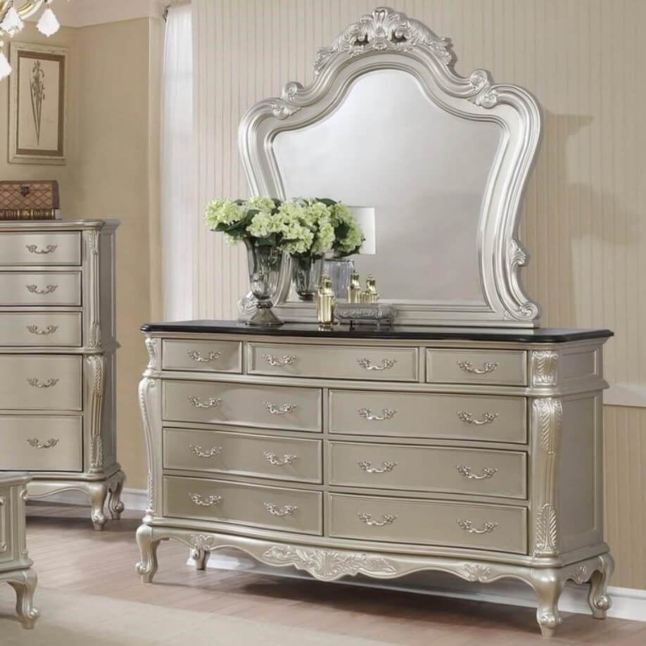 A bedroom dresser mirror with a sleek design, creating an illusion of space and light in the room decor.