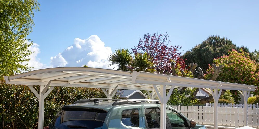 Canopy next to car door to unload in rain